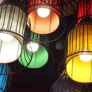 34751888 - purple, green, yellow, white, red and orange round stylish lampshades hang from ceiling